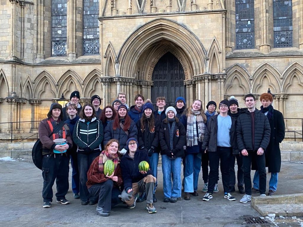 A photo of around 20 trevs students stood outside York Minster, a majestic cathedral.