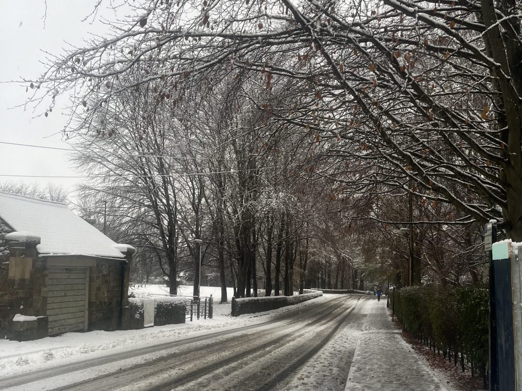 A picture of the street outside Trevs, looking past the Mash room towards Van Mildert. The streets are covered in snow