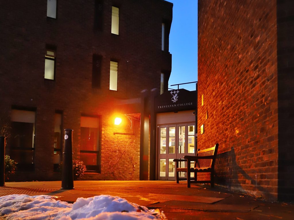 A picture showing the entrance to Trevs on a snowy evening