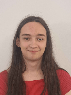 A headshot of a girl with brown hair