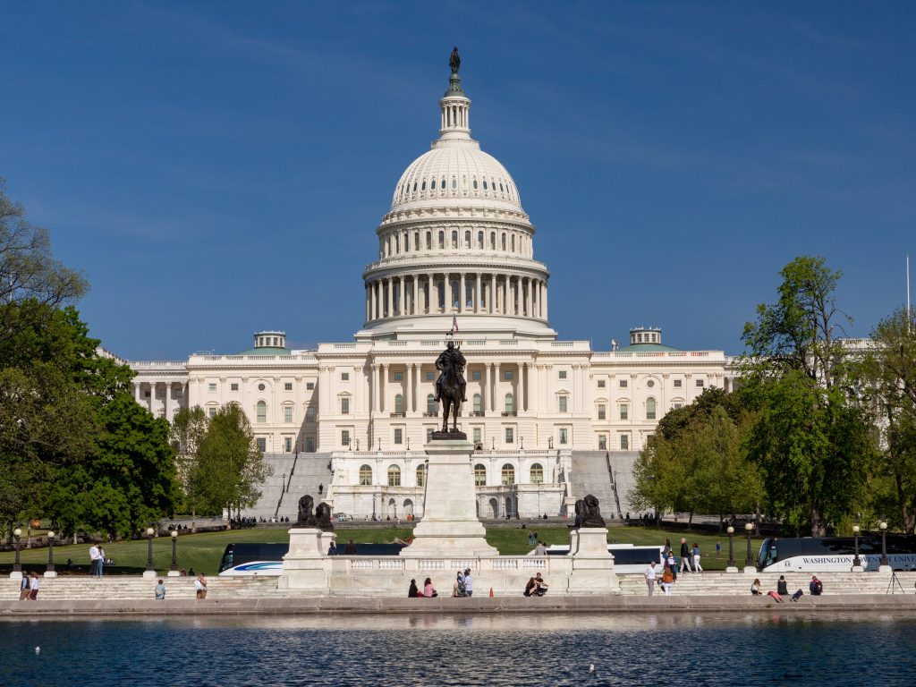 An image of the US Capitol in Washington DC, on a bright sunny day.