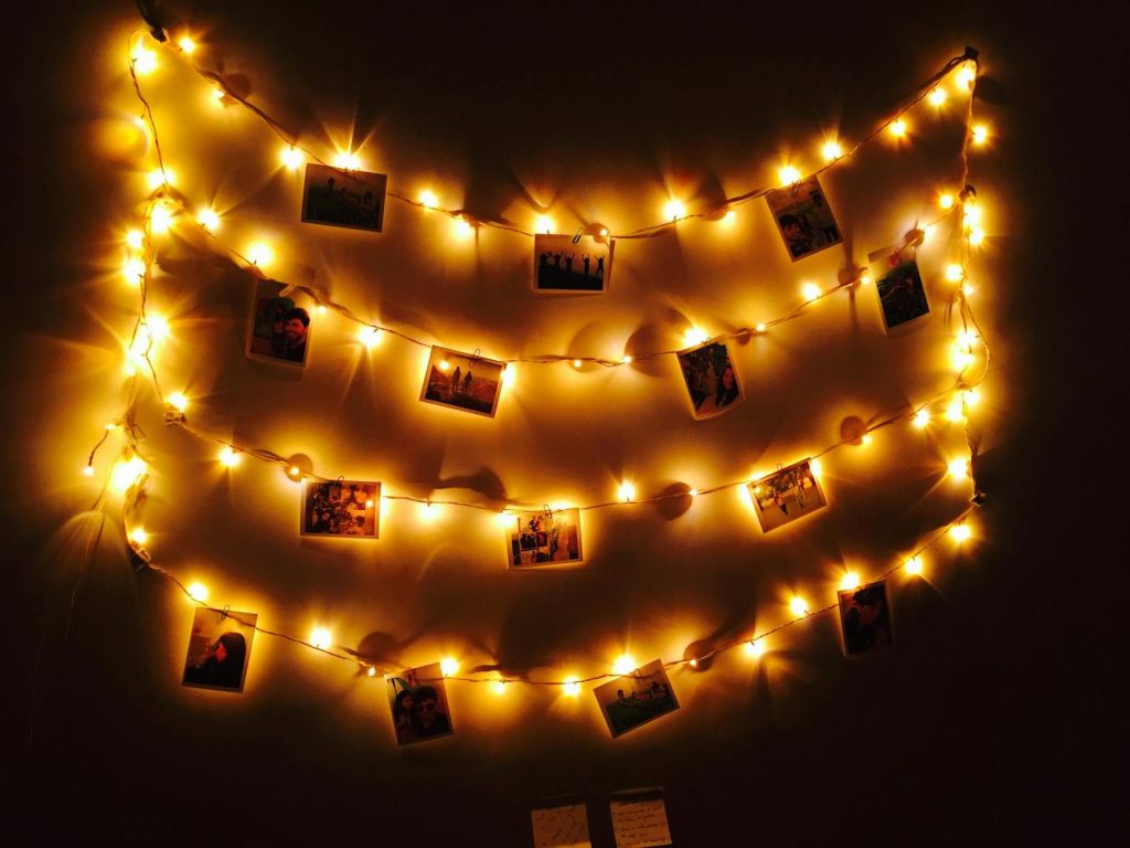 Strings of fairy lights and photographs.
