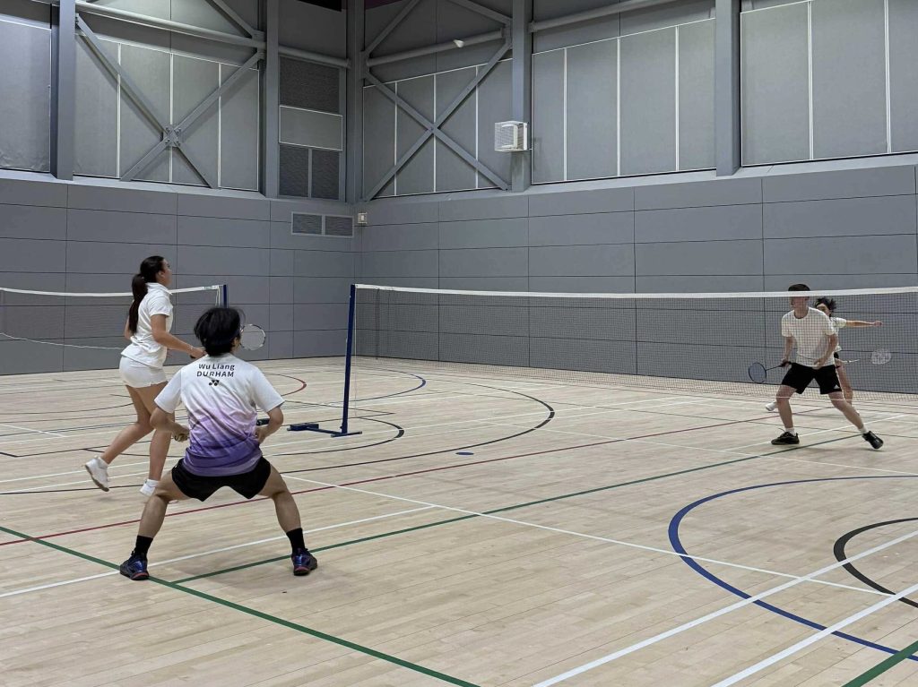 Trevs Mixed A in action against Van Mildert Mixed A: two doubles pairs are poised as the shuttle is high in the air.