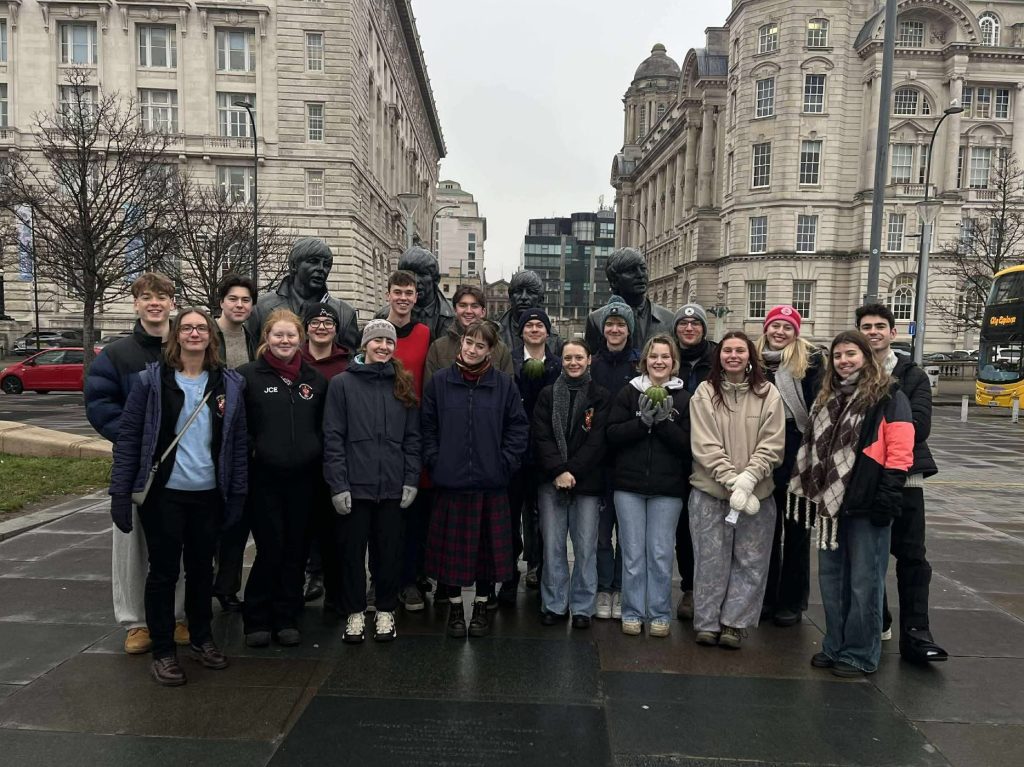 The Manglers in front of The Beatles' statue in Liverpool