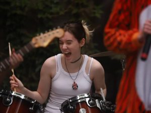 An image of Bex Smith playing drums at Trevstock