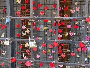 Heart-shaped locks on a fence