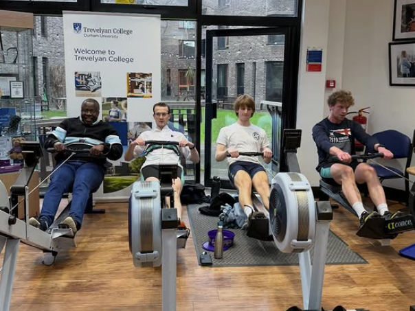 Image of Kunle rowing with TCBC during the erg-a-thon