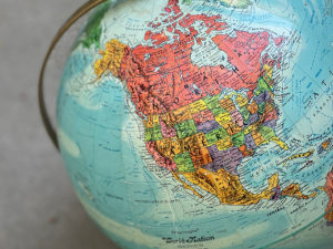 A picture of a globe with America and Canada in focus