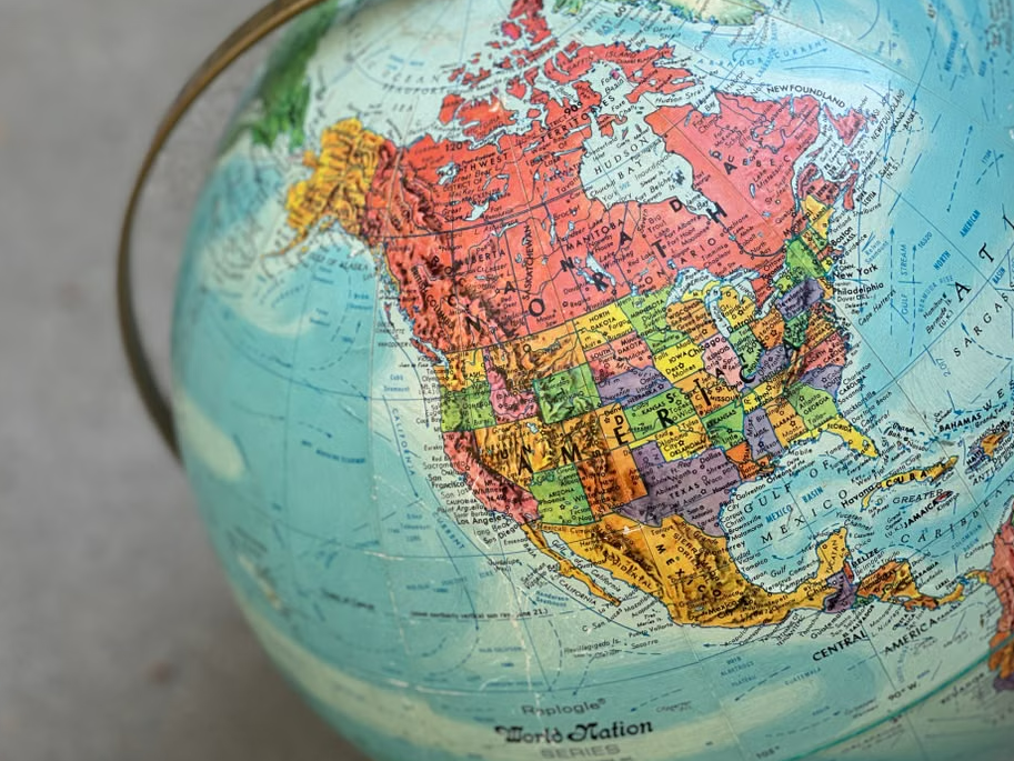 A picture of a globe with America and Canada in focus